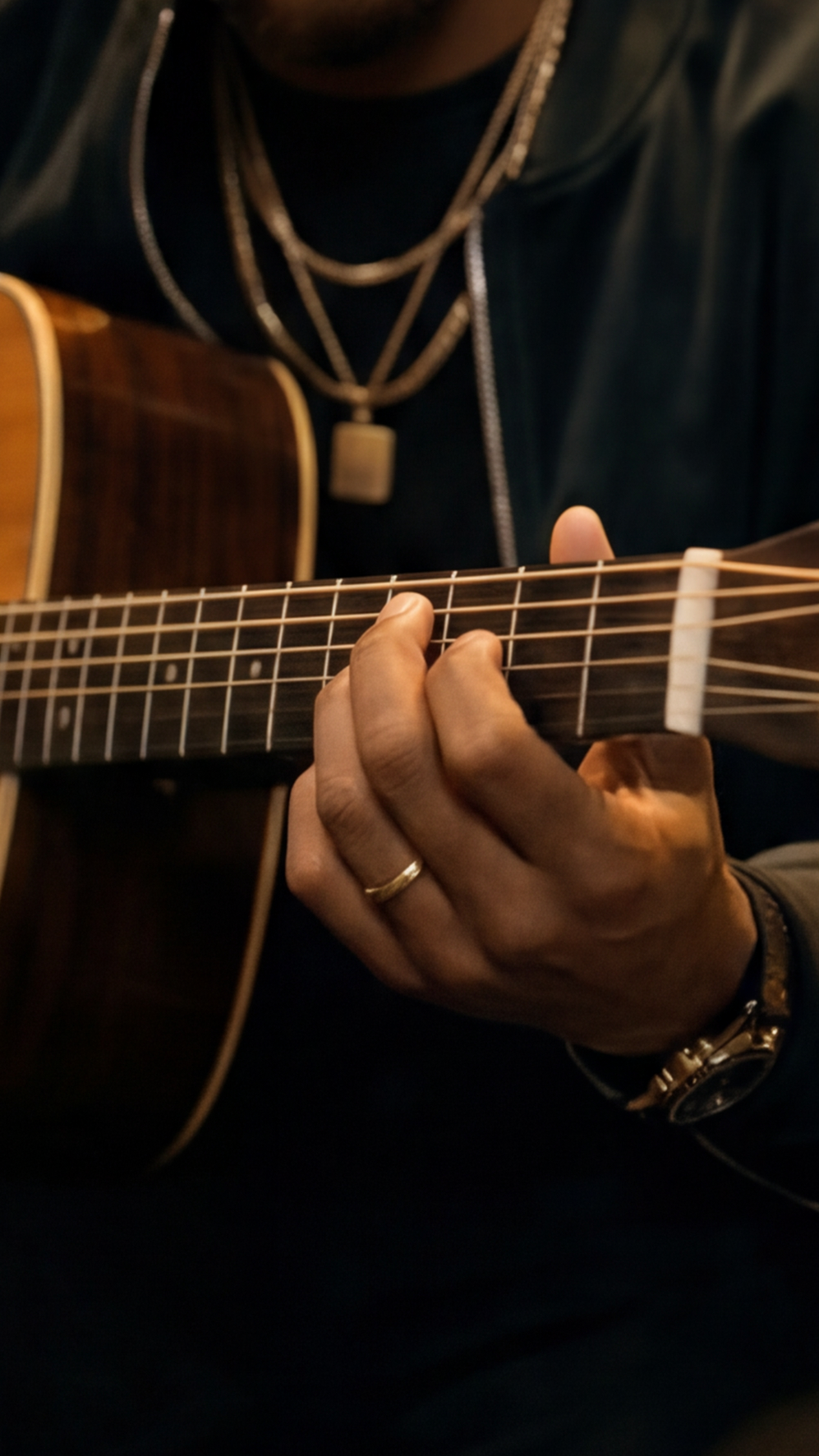 A musician's hands shaping a chord on the fretboard